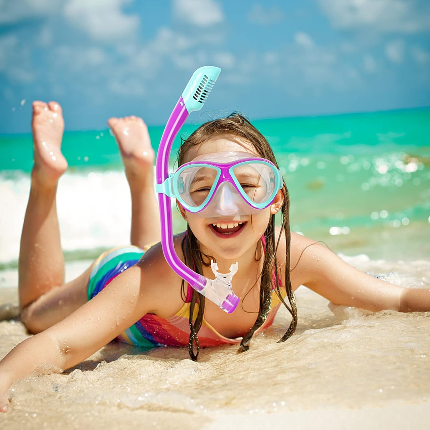 Children using colorful snorkeling masks and fins in clear blue water with bright natural lighting